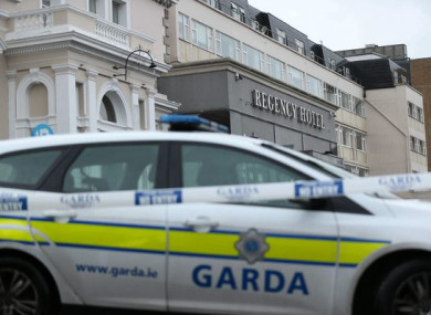The sealed-off scene of the Regency Hotel, in the aftermath of the shooting.