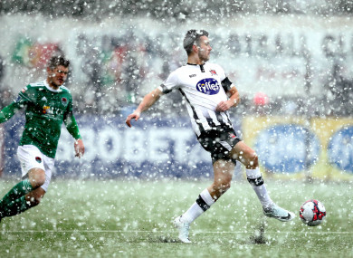 Dundalk's Michael Duffy and Colm Horgan of Cork City in the snow.