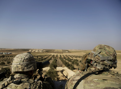 American troops look out toward the border with Turkey from a small outpost.