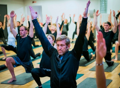Bjoern Borg CEO Henrik Bunge (C) is pictured during a yoga class in Stockholm