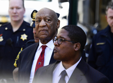 Bill Cosby looks around before he leaves the Montgomery County Courthouse.