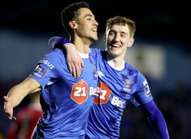 Waterford's Courtney Duffus celebrates scoring a goal with John Martin.
