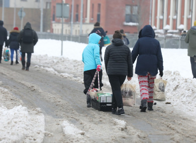 People walking in the snow during Storm Emma in March.