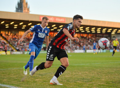 Eoghan Stokes in action against Jamie Lennon at Dalymount Park.
