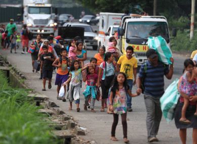 People evacuate after the eruption of the Fuego volcano