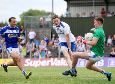 Graham Brody saves a shot from Conor McManus.