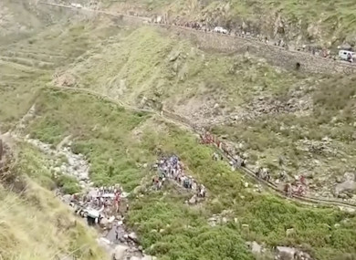 This grab made from video provided by KK Productions, shows the area of a deadly bus accident in Uttarakhand's Paudi Garhwal district, northern India.
