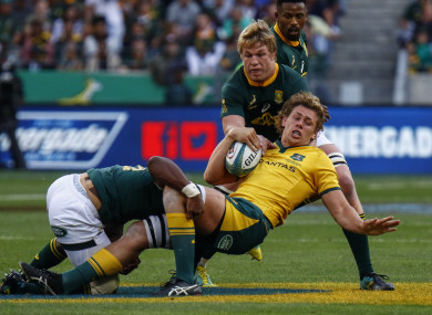 Ned Hanigan is tackled by Pieter-Steph du Toit in Port Elizabeth.
