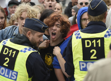 Police push back protestors during a far-right