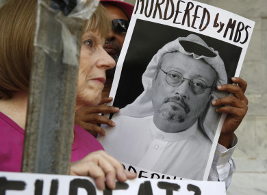 A protester holds a sign of missing journalist Jamal Khashoggi outside the Saudi Arabian embassy in Washington, D.C.
