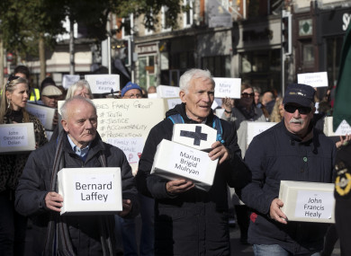 People march carrying boxes representing the victims of those who died in Tuam during a silent procession for the Tuam Babies from Garden of Remembrance this month.