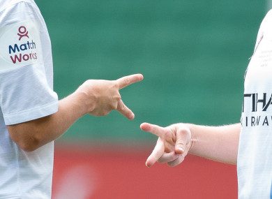 File photo of two players playing 'rock, paper scissors'.