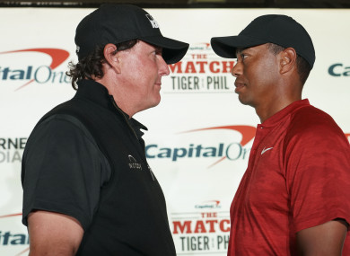 Phil and Tiger stand face-to-face.