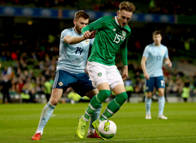 Ronan Curtis under pressure from Northern Ireland's Stuart Dallas during his Republic of Ireland debut.