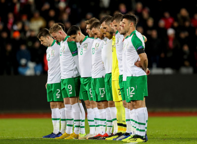 The Ireland team observe a silence ahead of the game with Denmark in tribute to 30 year-old David Clerkin.