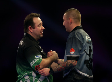 Brendan Dolan (left) is consoled by Nathan Aspinall.