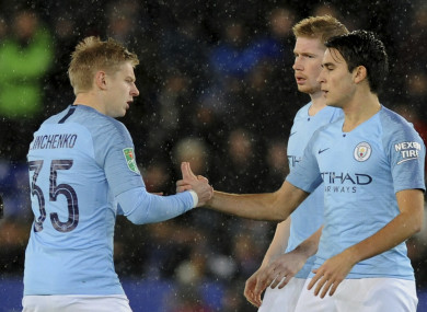 Manchester City's Oleksandr Zinchenko, left, and teammate Eric Garcia, shake hands just prior to kick-off.