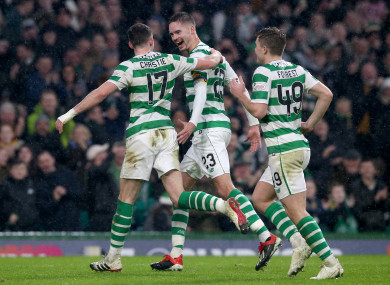 Ryan Christie (left) celebrates scoring his side's fourth goal.