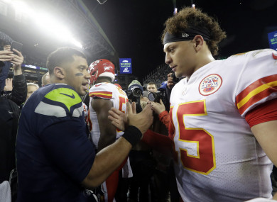Seattle Seahawks quarterback Russell Wilson, left, greets Kansas City Chiefs quarterback Patrick Mahomes.