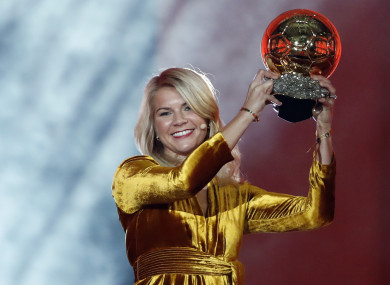 Ada Hegerberg celebrates with the Women's Ballon d'Or award.