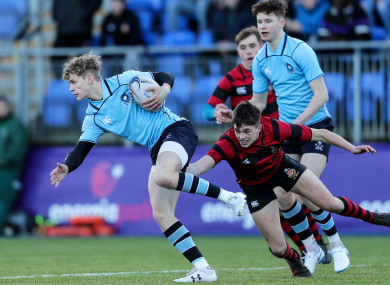 Darragh O'Reilly tackles Andrew Smith of St MIchael's.