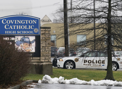 A police car sits at the entrance to Covington Catholic High School