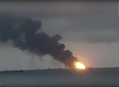 In this video grab provided by the Kerch.fm web portal, the two vessels, the Maestro and the Candiy, on fire near the Kerch Strait linking the Black Sea and the Sea of Azov, in Kerch, Crimea.
