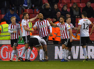 Sheffield United's David McGoldrick is congratulated on scoring his team's opening goal.