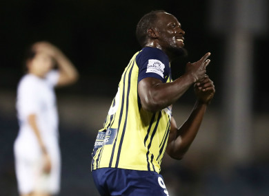 Usain Bolt celebrates scoring for the Mariners.
