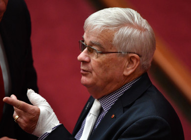 United Australia Party Senator Brian Burston with a bandaged hand in the Senate chamber in Canberra