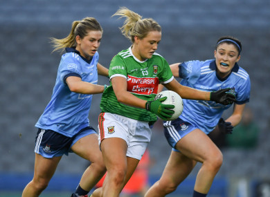 Fiona Doherty of Mayo races past Martha Byrne, left, and Olwen Carey of Dublin on her way to scoring her side's third goal.