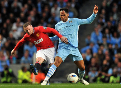 Lescott and Rooney battling for possession in 2012.