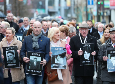 Families of those who died march through the Bogside in Derry today ahead of the announcement.