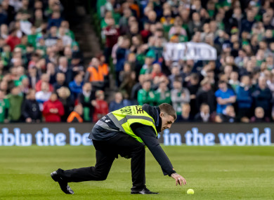 A steward removed a tennis ball from the Aviva Stadium pitch on Tuesday night.