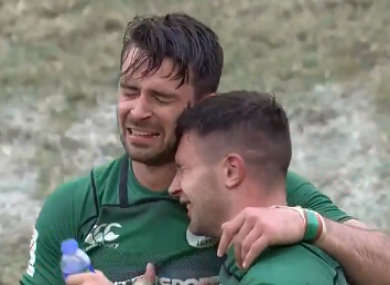 An emotional Greg O'Shea embraces a teammate after Ireland's Sevens win against Hong Kong.