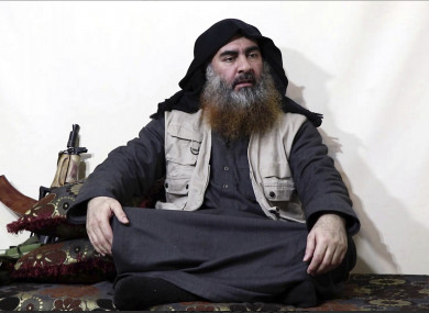 This image made from video posted on a militant website purports to show the leader of the Islamic State group, Abu Bakr al-Baghdadi, being interviewed by his group's Al-Furqan media outlet.