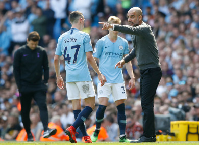 Guardiola speaks with Phil Foden at the Etihad.