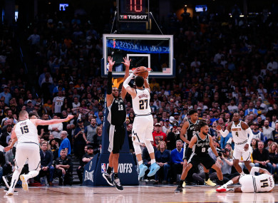 Jamal Murray attempts a shot over San Antonio Spurs center LaMarcus Aldridge.