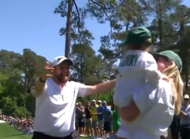 Shane Lowry celebrates with his daughter Iris and wife Wendy.