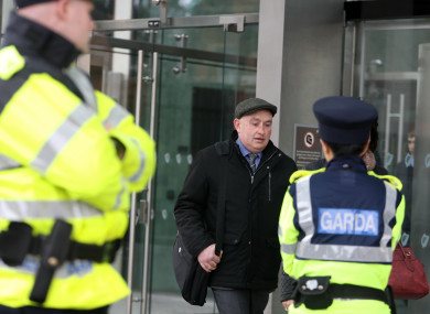 Patrick Quirke walks past gardaí at the Criminal Courts of Justice (CCJ) in Dublin.