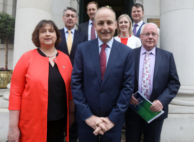 Party leader Micheál Martin with candidates Billy Kelleher (yellow tie), Brendan Smith (front right), Barry Andrews (back left), Anne Rabbitte (left front) and Malcolm Byrne (purple tie).
