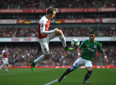 Arsenal's Nacho Monreal and Brighton & Hove Albion's Anthony Knockaert.