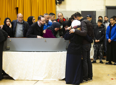 The parents of Azzam Raguragui at his coffin in the Islamic Cultural Centre in Dublin today.