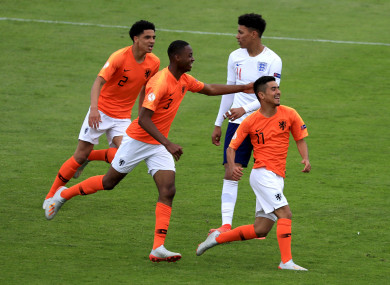 Naci Unuvar celebrates scoring the Netherlands' fifth goal at Tolka Park.