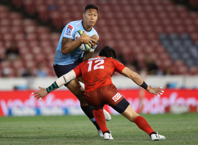 Folau tackled by Harumichi Tatekawa in March.