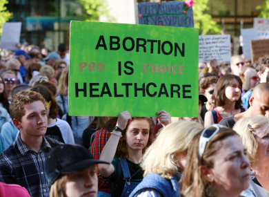 People participate in a protest against abortion ban.
