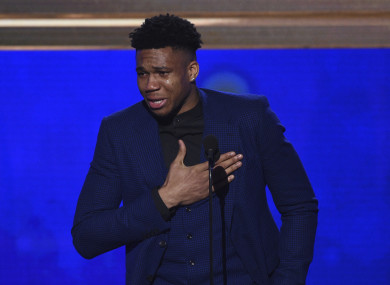 NBA player Giannis Antetokounmpo, of the Milwaukee Bucks, reacts as he accepts the most valuable player award.