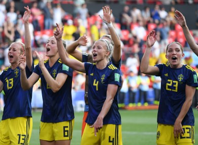 The Swedish players celebrate their remarkable upset.