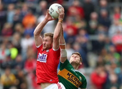 Cork's Ruairi Deane and Kerry's Gavin White in action.