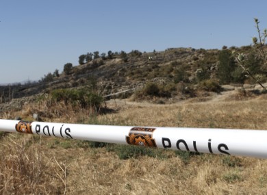 Turkish Cypriot police cordon off the area after an explosion outside of Tashkent in the Turkish Cypriot breakaway north part of Cyprus.